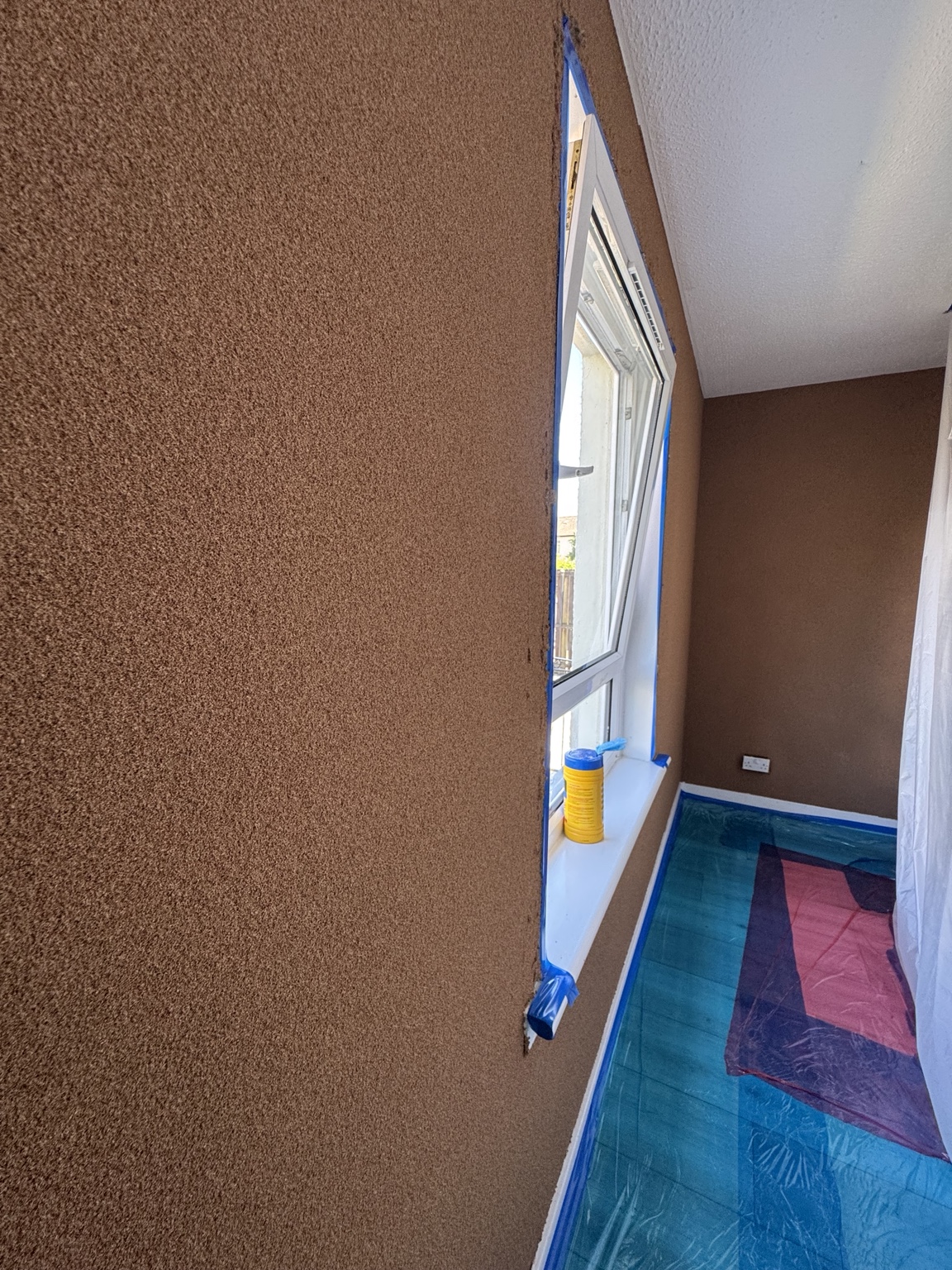 CorkSol-coated bedroom walls during an internal installation in Glasgow